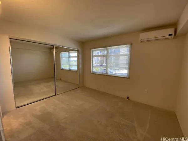 an empty room with an entrance to other room