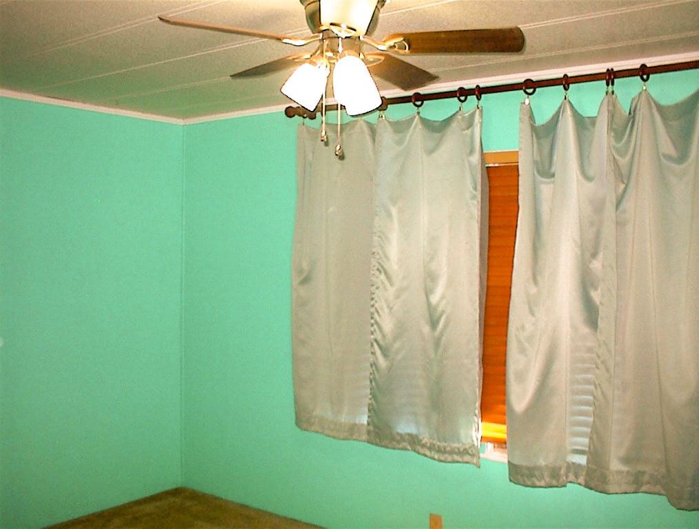 37314 Mistletoe Road Squaw Valley, CA 93675 - Photo 20 of 27 a bathroom with a shower curtain and a clock
