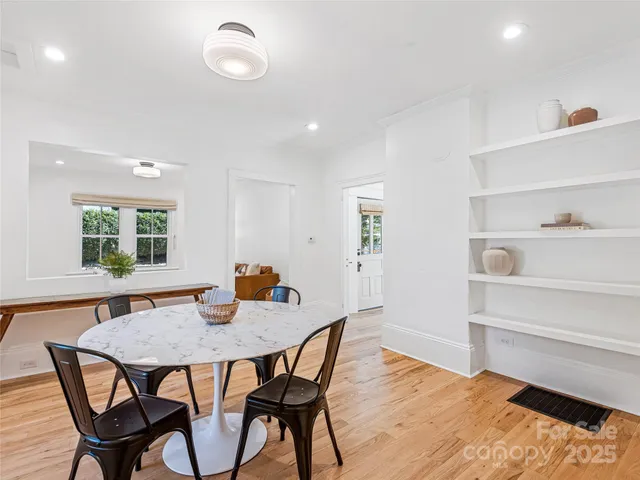 a view of a dining room with furniture and window
