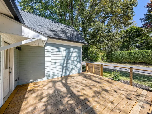 a view of house with backyard and sitting area