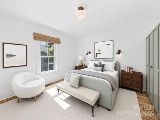 a spacious bedroom with a bed and window