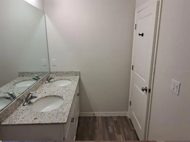 a bathroom with a toilet and a bath tub