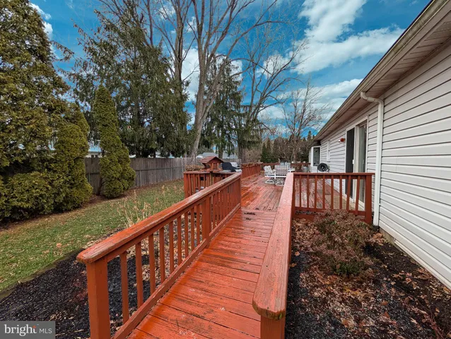 a view of a balcony with wooden floor