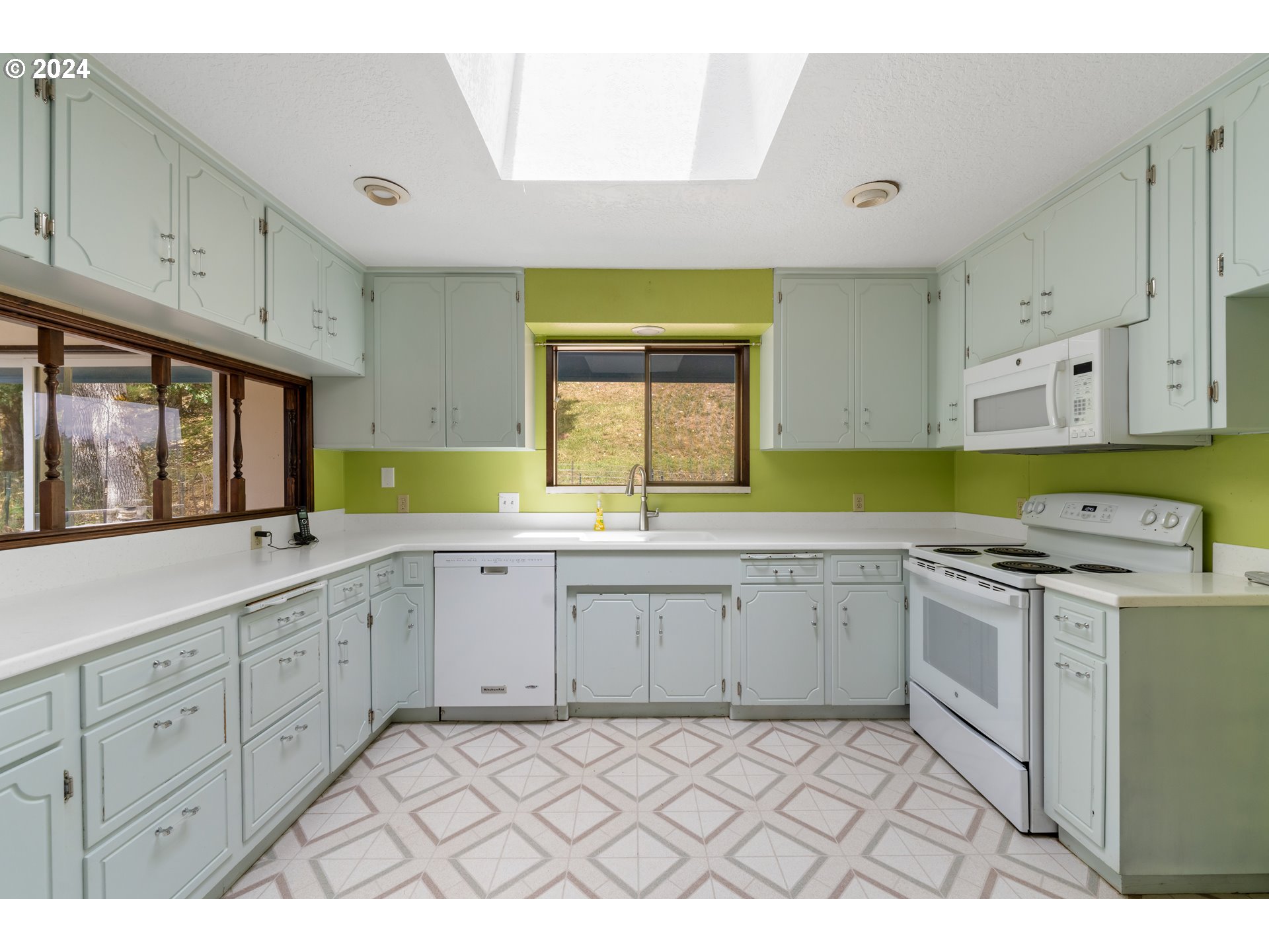 1234 Spring Brook Road Myrtle Creek, OR 97457 - Photo 3 of 45 a kitchen with a sink cabinets and window