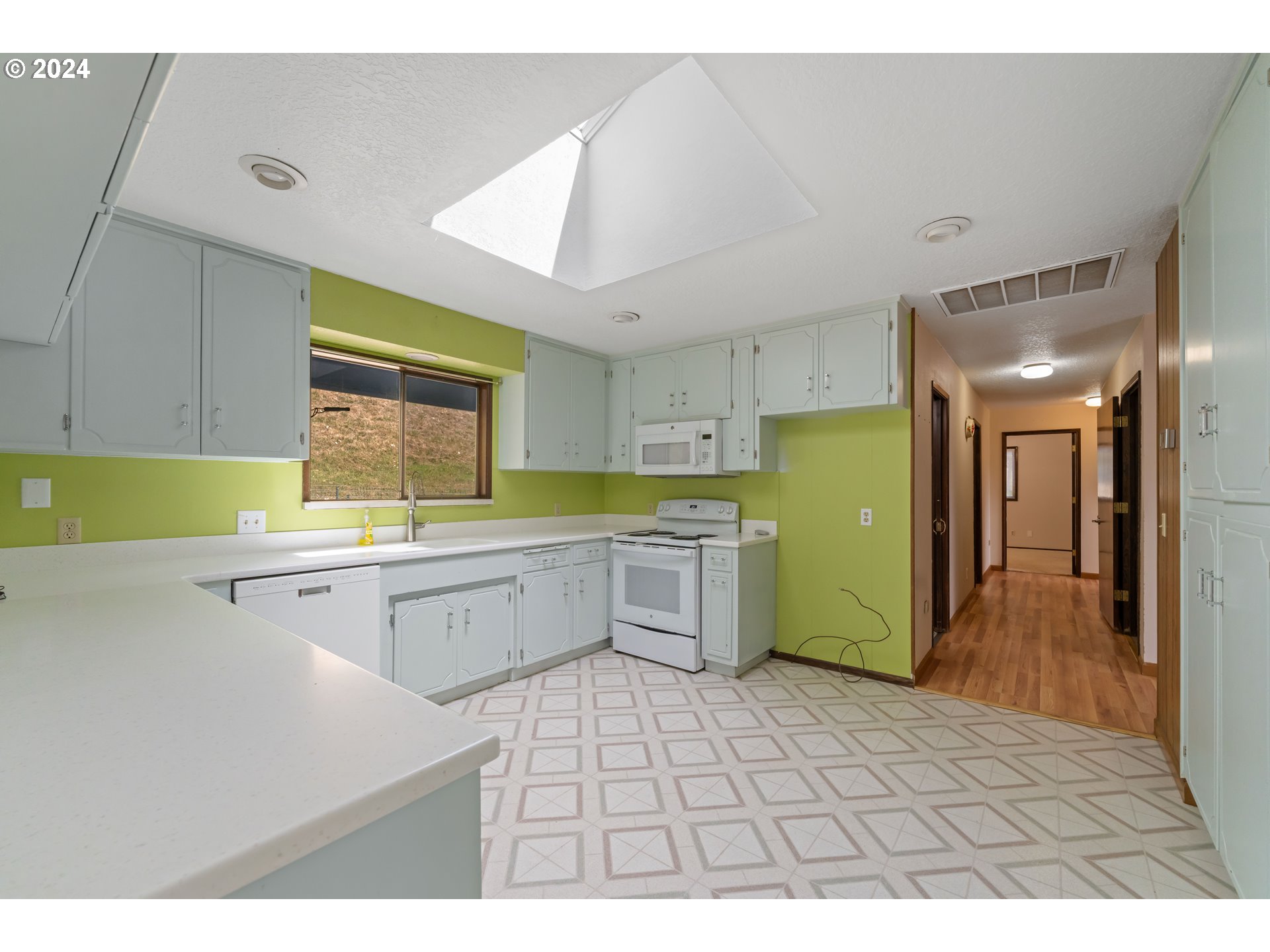 1234 Spring Brook Road Myrtle Creek, OR 97457 - Photo 6 of 45 a kitchen with a sink cabinets and window