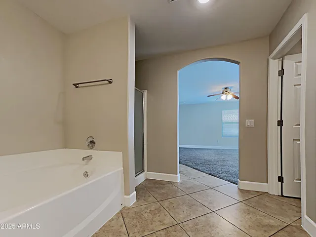 a bathroom with a bathtub and shower