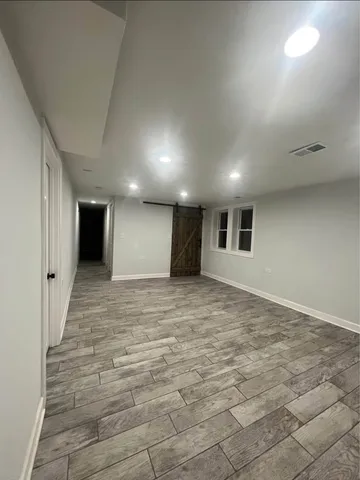 a bathroom with a double vanity sink mirror and bathtub