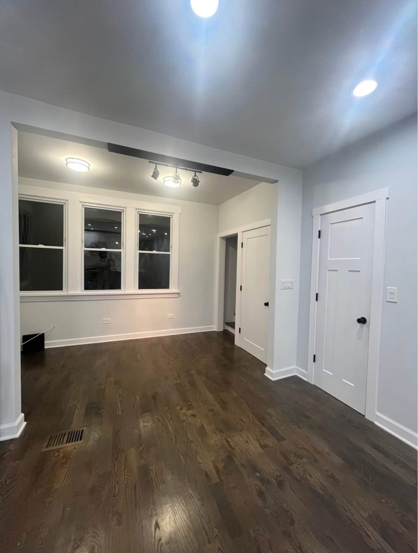 5212 South Lorel Avenue Chicago, IL 60638 - Photo 7 of 17 a view of empty room with wooden floor
