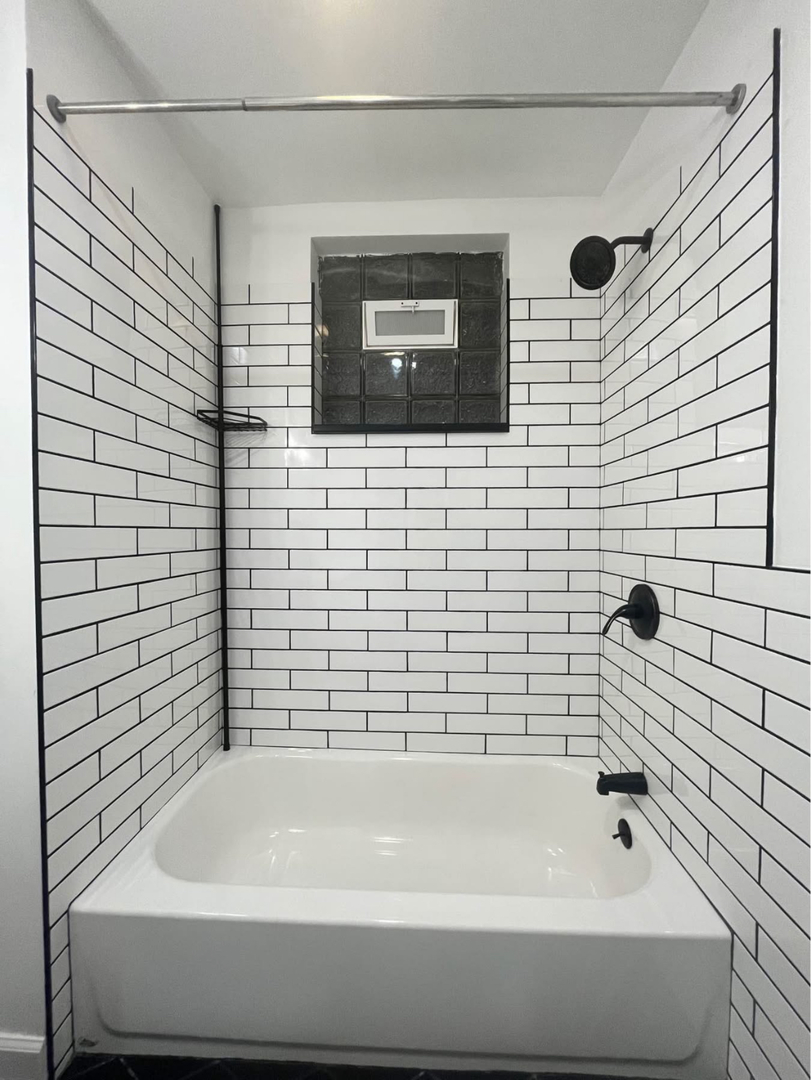5212 South Lorel Avenue Chicago, IL 60638 - Photo 9 of 17 a bathroom with a bathtub and a shower