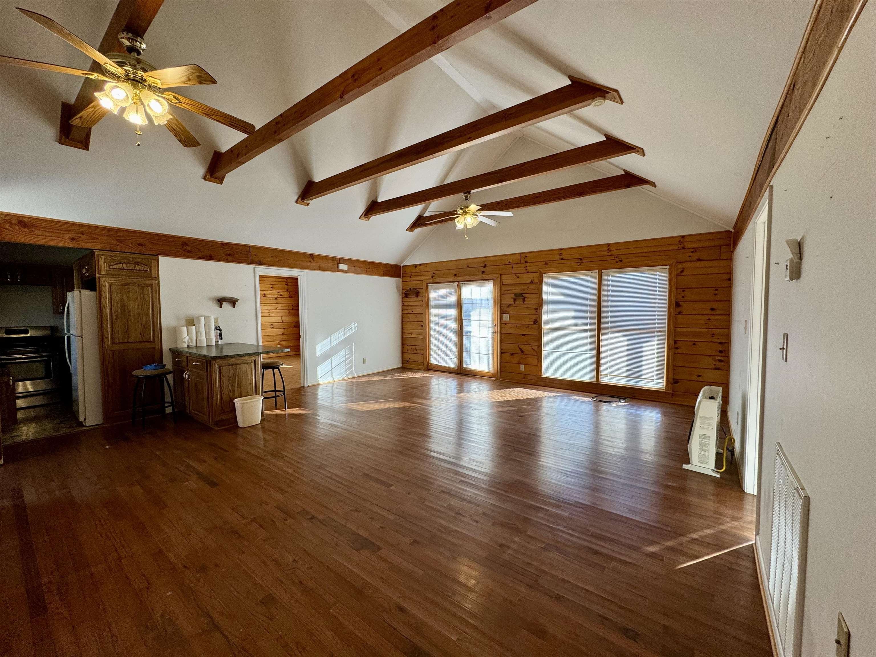 a view of a hall with wooden floor