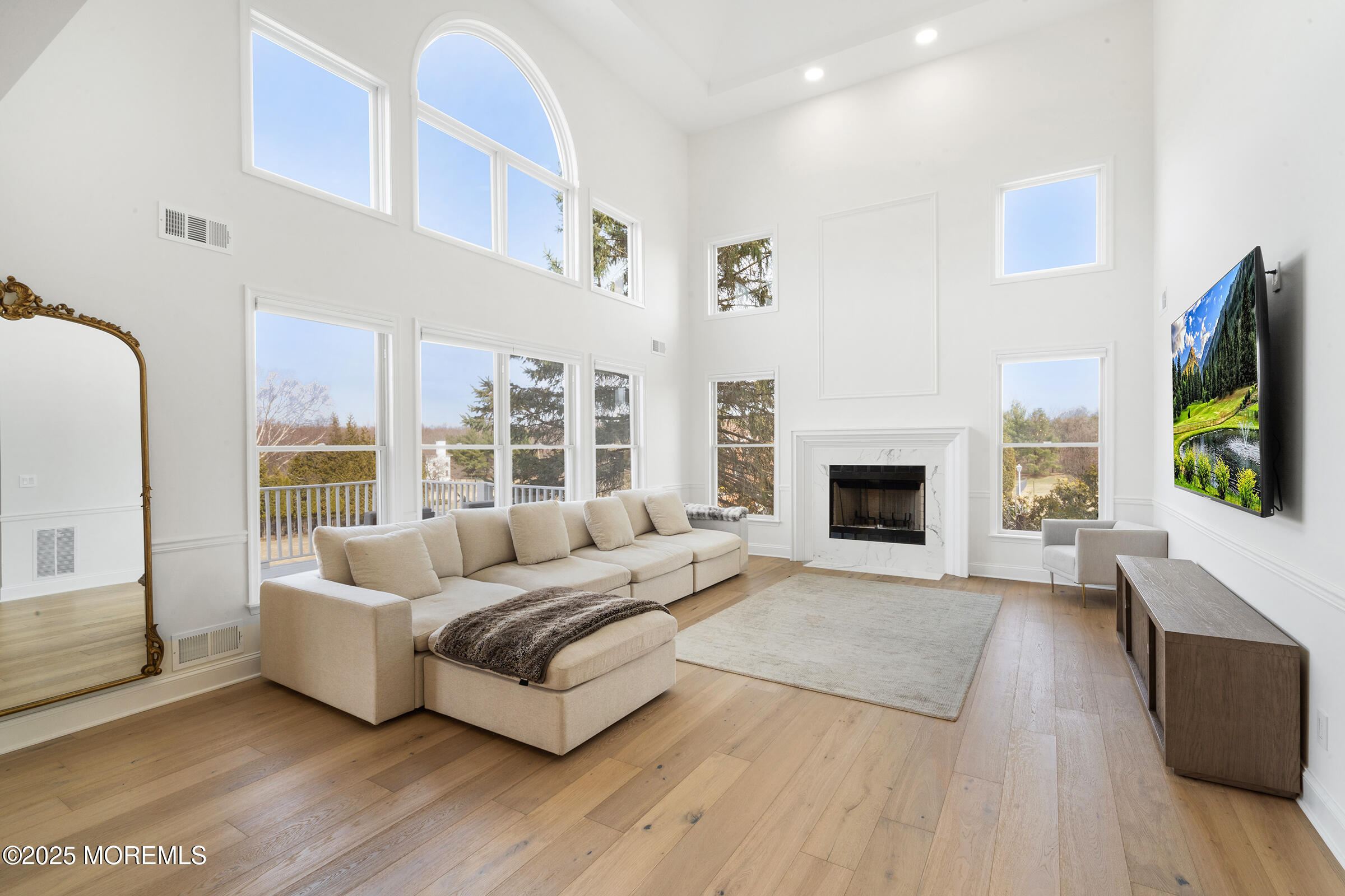 57 Moore Road Marlboro, NJ 07746 - Photo 11 of 53 a living room with furniture fireplace and flat screen tv