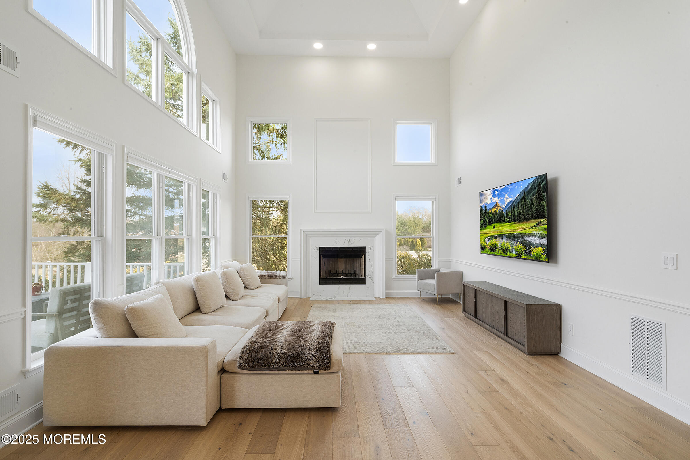 57 Moore Road Marlboro, NJ 07746 - Photo 12 of 53 a living room with furniture fireplace and flat screen tv