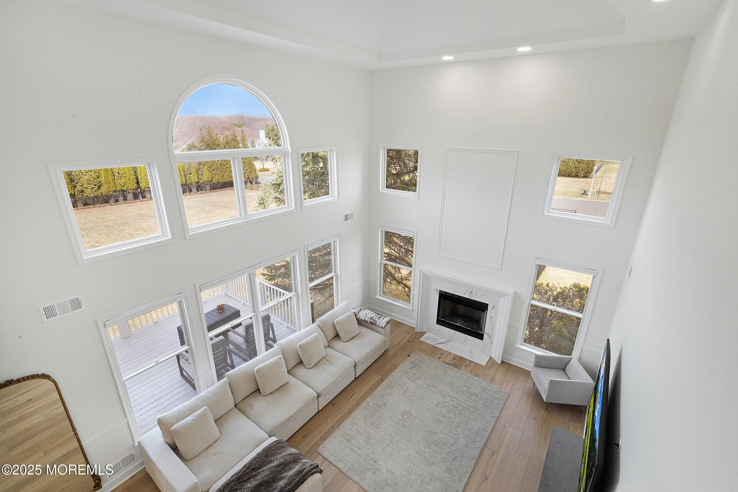 57 Moore Road Marlboro, NJ 07746 - Photo 13 of 53 a living room with furniture and a fireplace