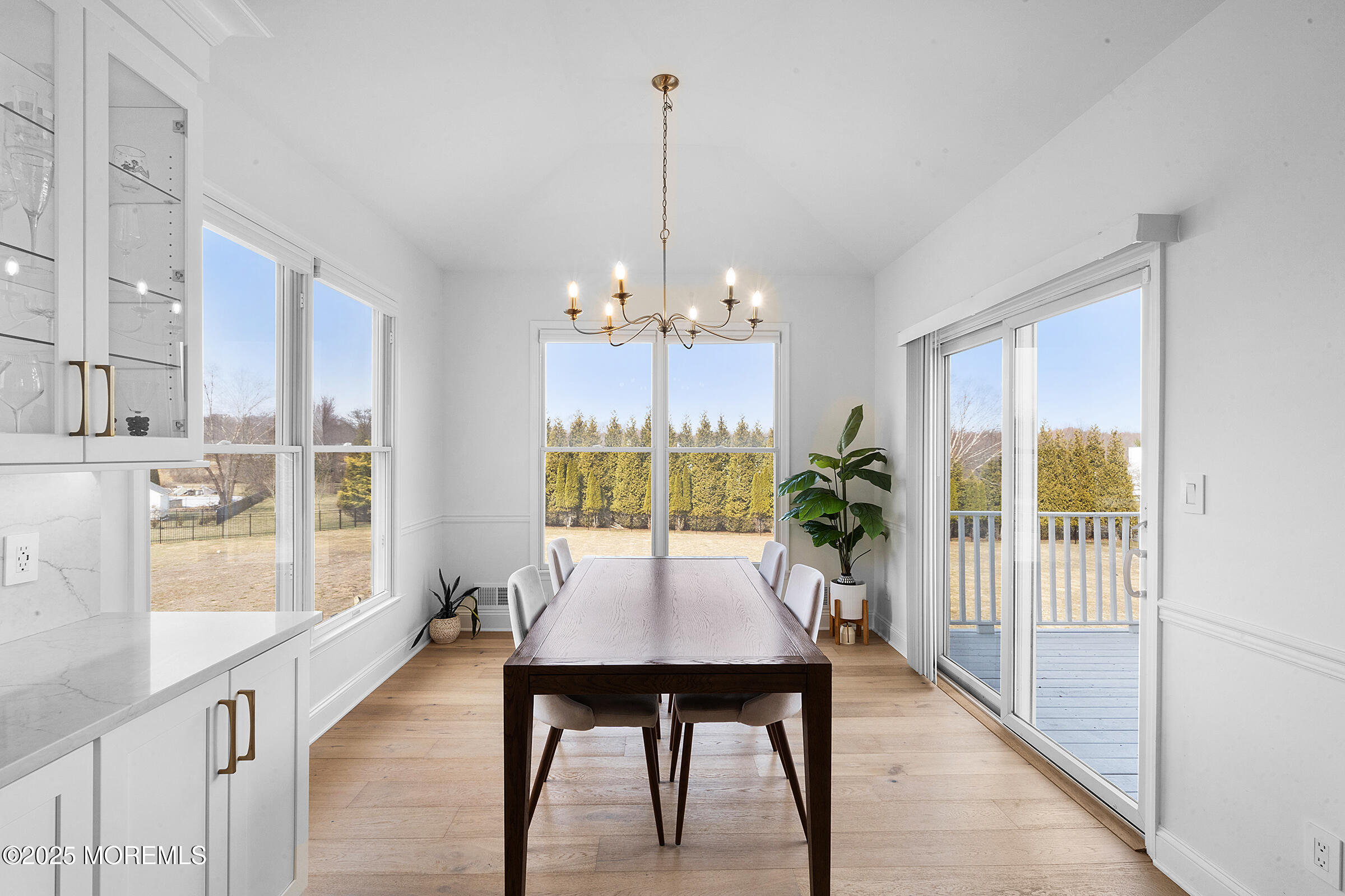 57 Moore Road Marlboro, NJ 07746 - Photo 14 of 53 a view of a dining room with furniture window and wooden floor