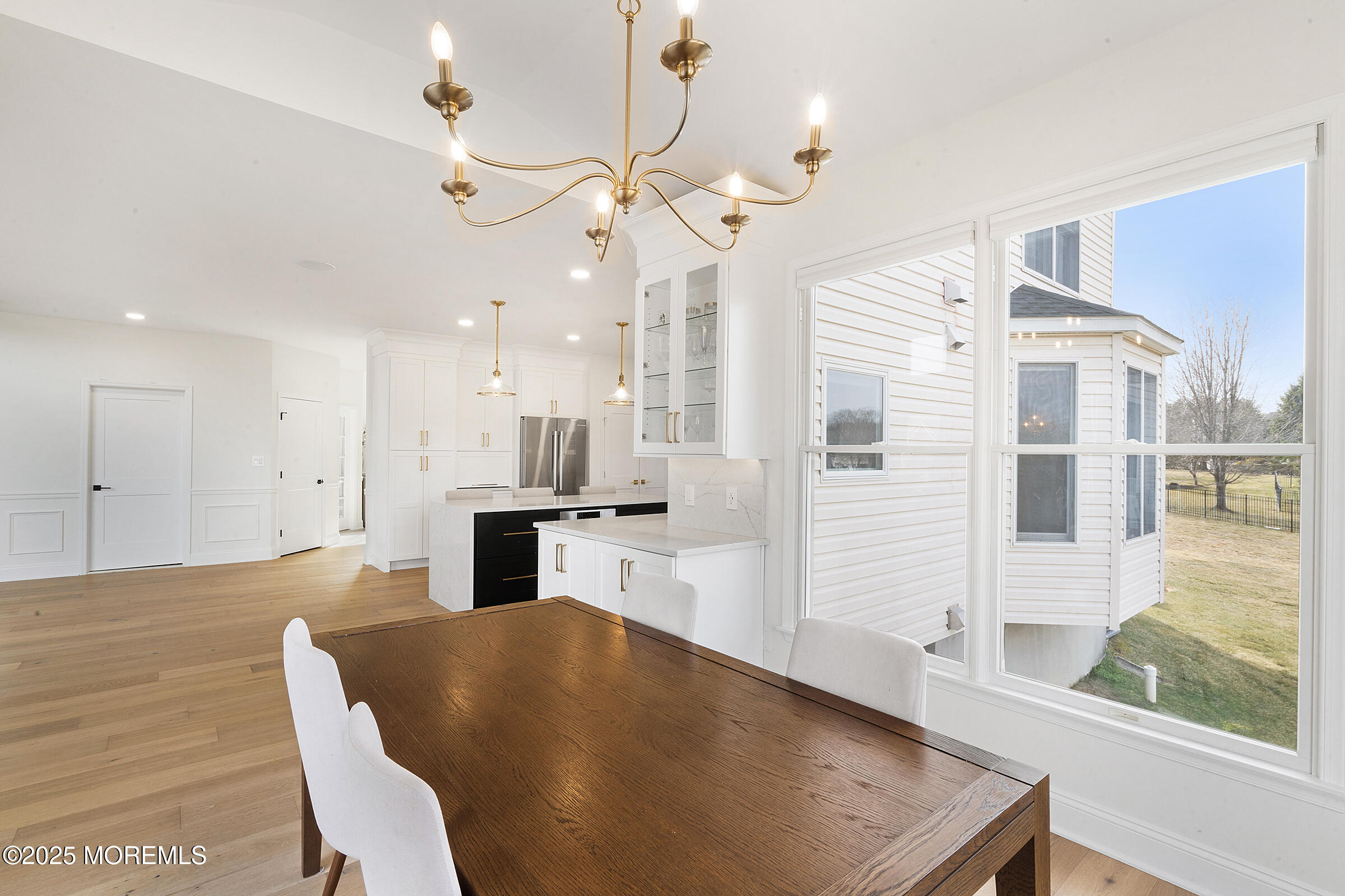 57 Moore Road Marlboro, NJ 07746 - Photo 15 of 53 a large kitchen with kitchen island a large island a sink stainless steel appliances and cabinets