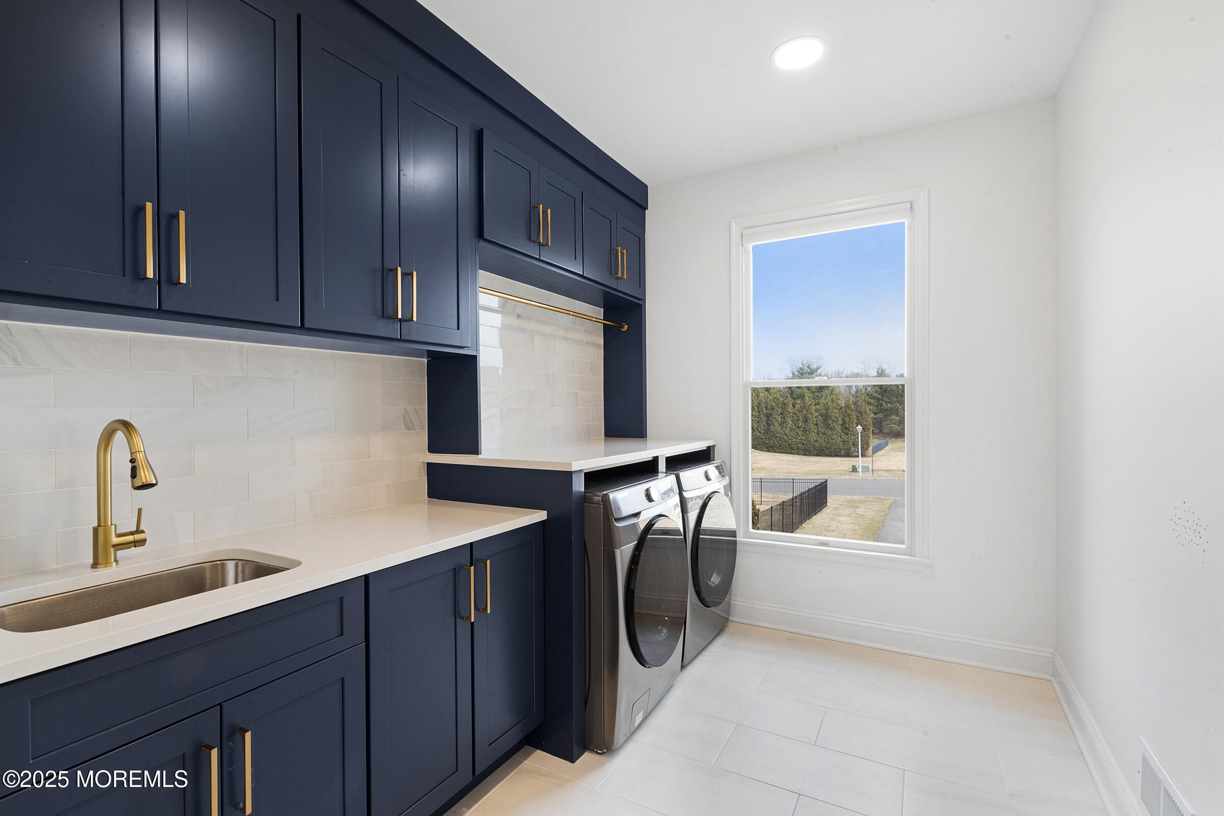 57 Moore Road Marlboro, NJ 07746 - Photo 17 of 53 a utility room with cabinets