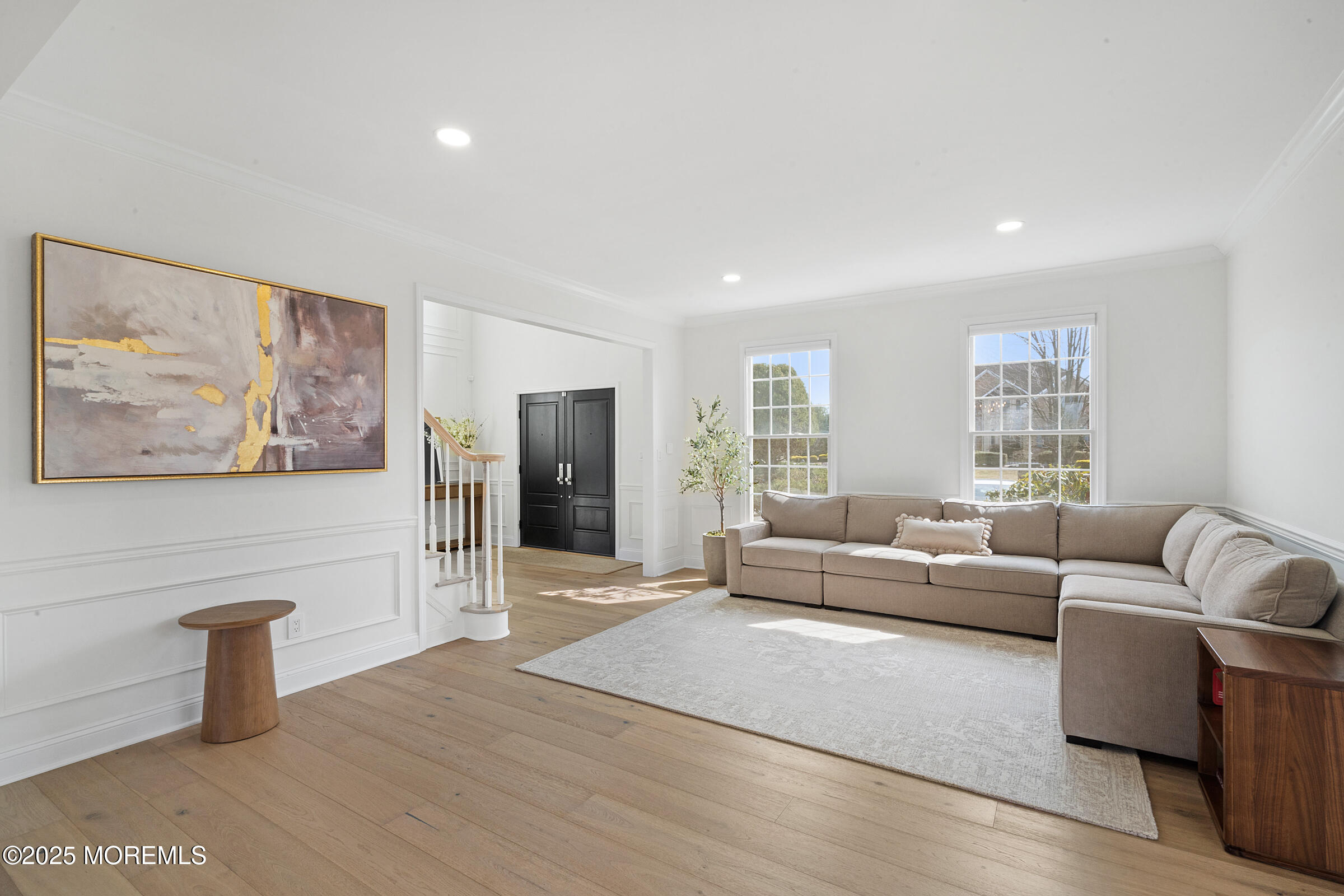 57 Moore Road Marlboro, NJ 07746 - Photo 21 of 53 a living room with furniture and a wooden floor