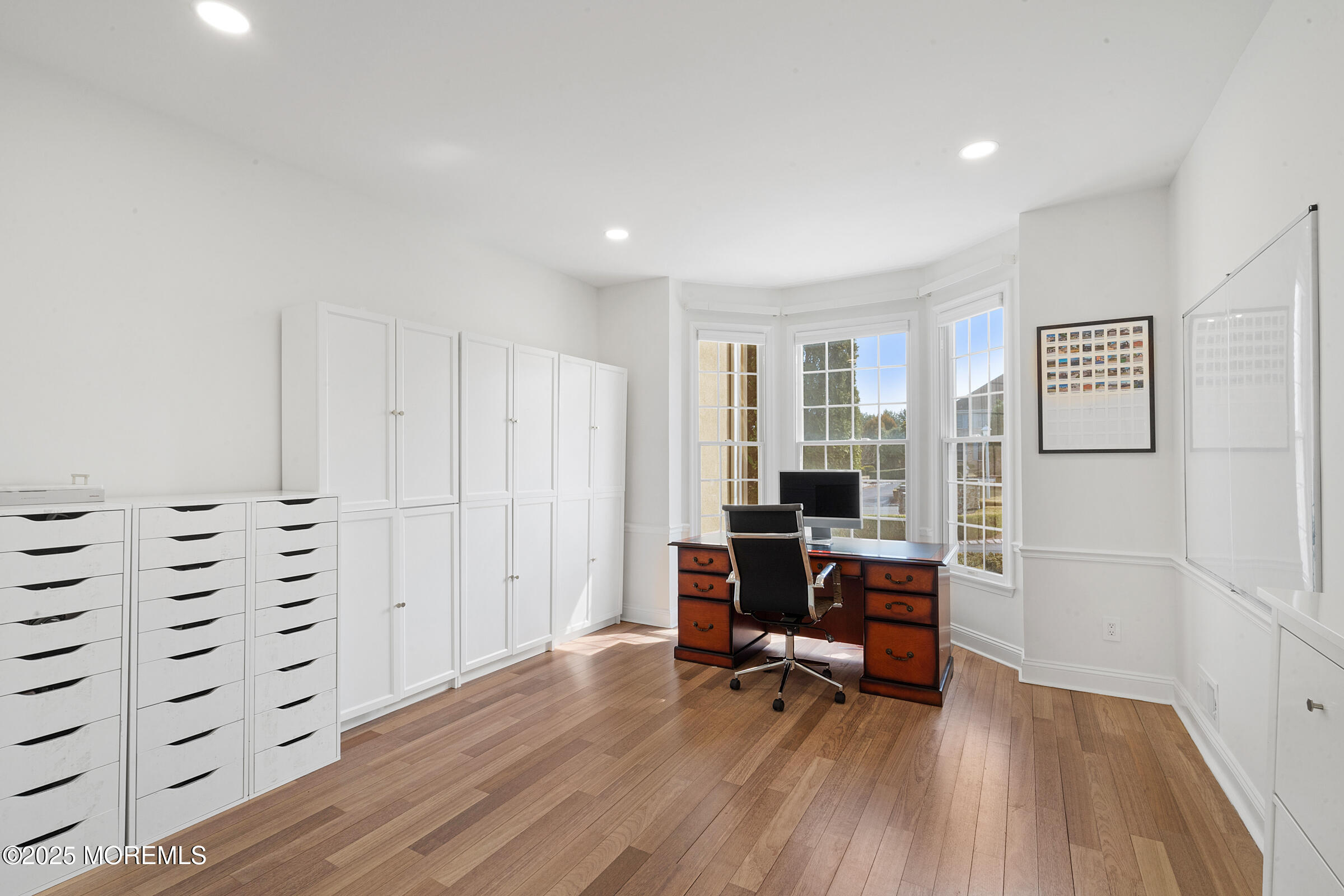 57 Moore Road Marlboro, NJ 07746 - Photo 23 of 53 a view of a livingroom with furniture and a workspace
