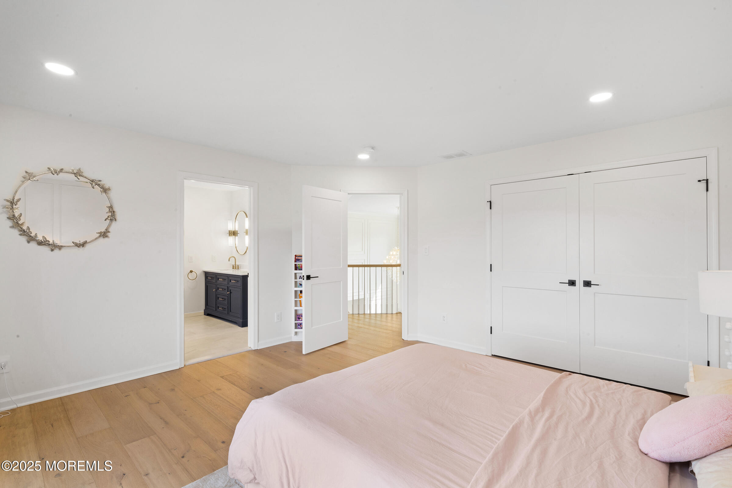 57 Moore Road Marlboro, NJ 07746 - Photo 34 of 53 a bedroom with a bed and a lamp