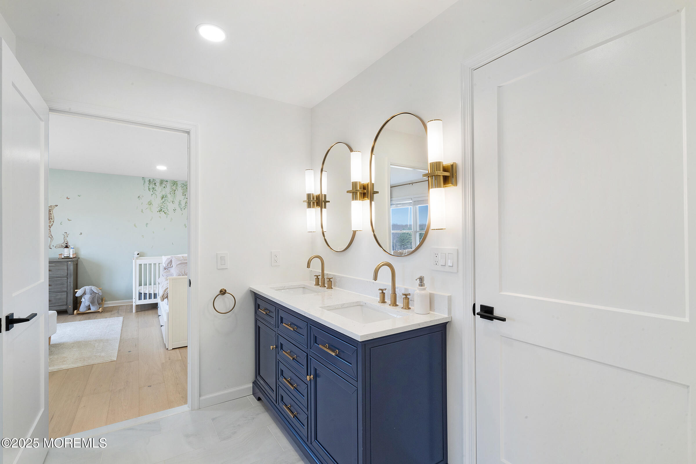 57 Moore Road Marlboro, NJ 07746 - Photo 36 of 53 a bathroom with a sink a mirror and a shower