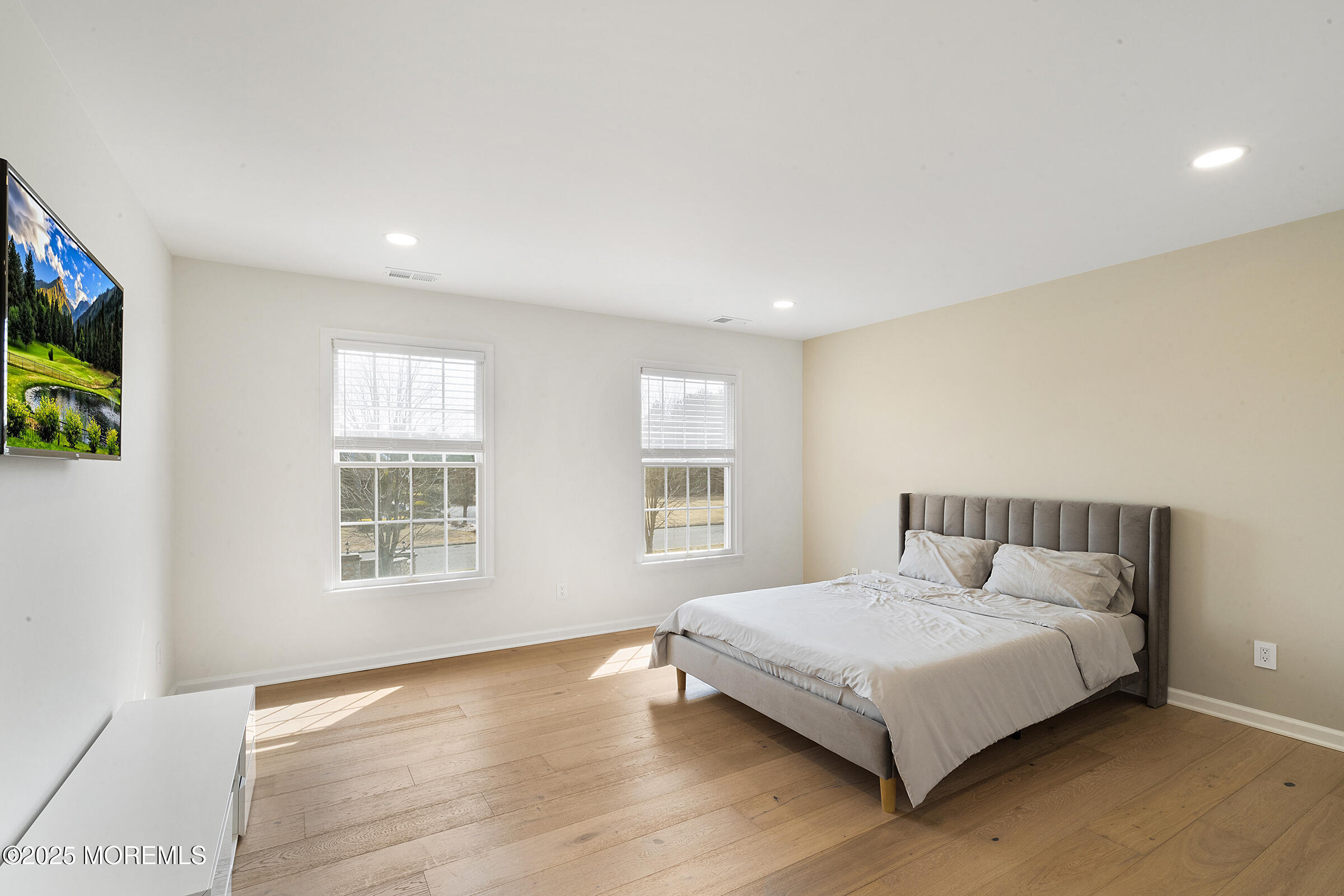 57 Moore Road Marlboro, NJ 07746 - Photo 38 of 53 a bedroom with a large bed and a window