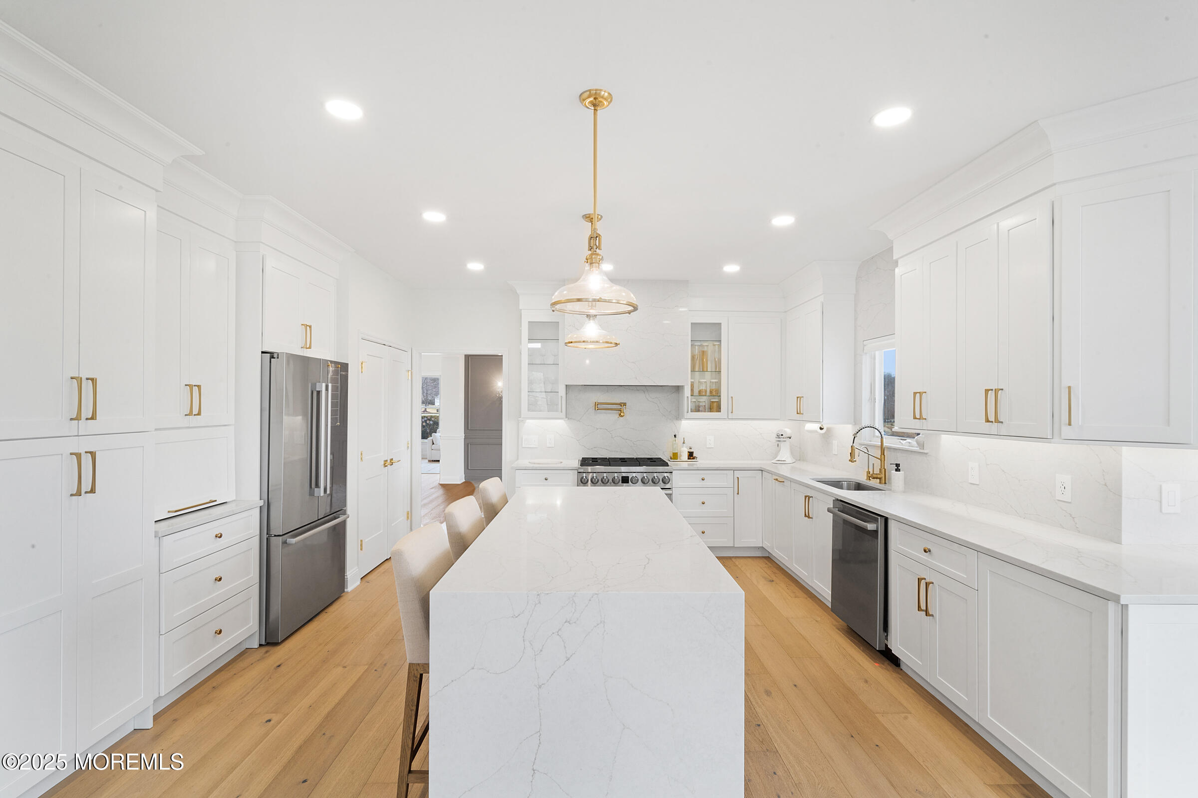 57 Moore Road Marlboro, NJ 07746 - Photo 5 of 53 a large kitchen with kitchen island a stove a sink a center island and stainless steel appliances