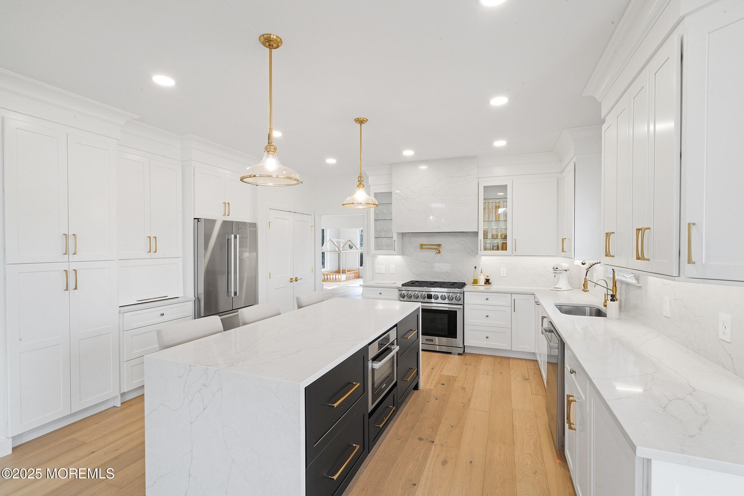 57 Moore Road Marlboro, NJ 07746 - Photo 6 of 53 a large kitchen with stainless steel appliances kitchen island granite countertop a sink a stove and a refrigerator
