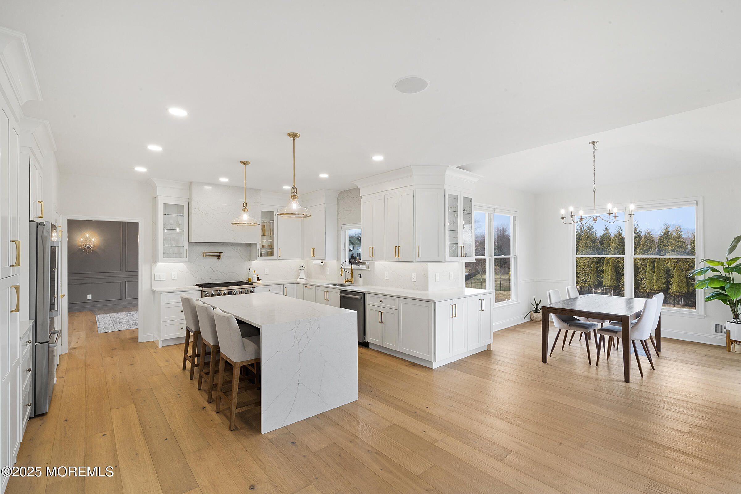 57 Moore Road Marlboro, NJ 07746 - Photo 8 of 53 a large white kitchen with lots of counter space and stainless steel appliances