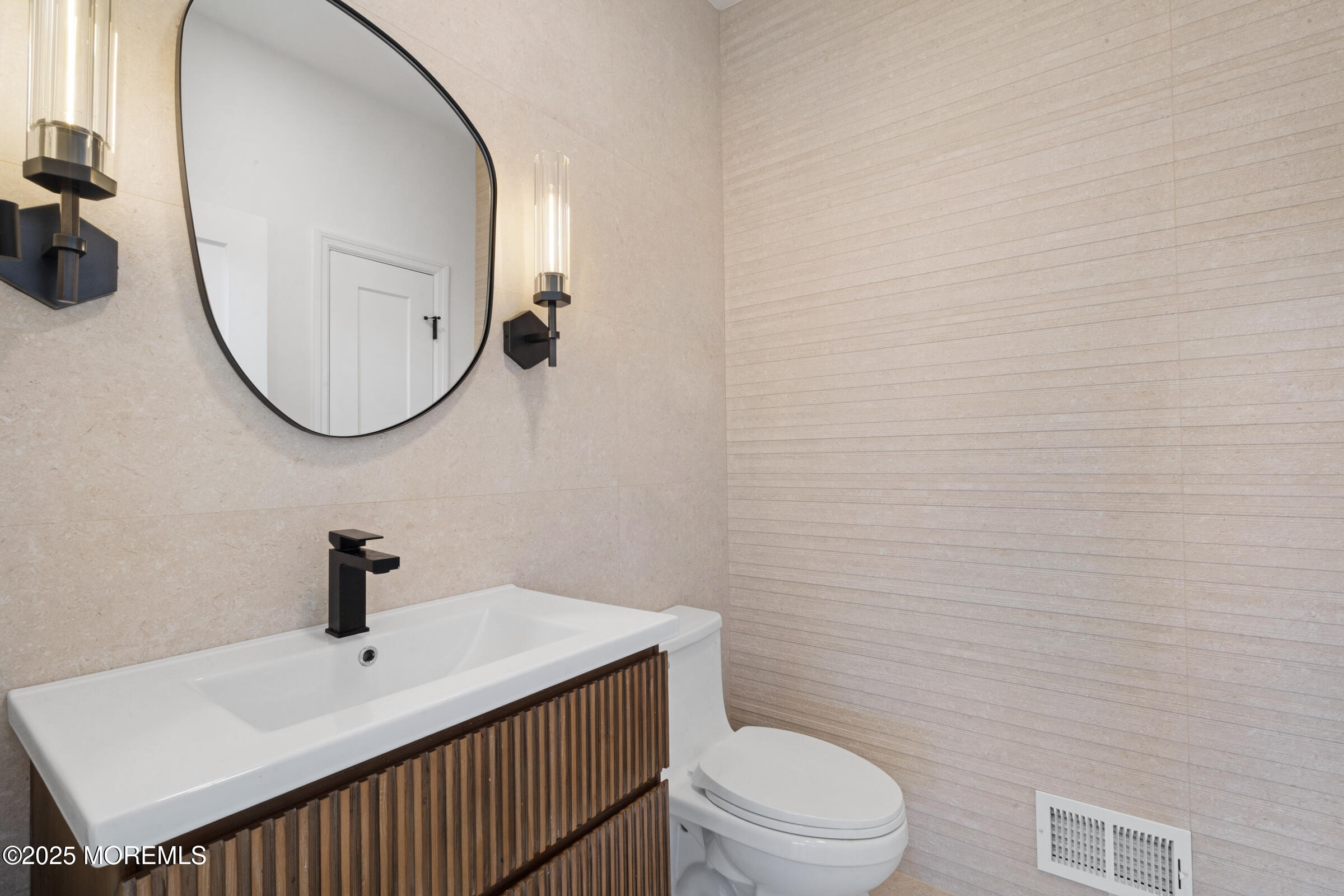 57 Moore Road Marlboro, NJ 07746 - Photo 9 of 53 a bathroom with a sink a toilet and a mirror