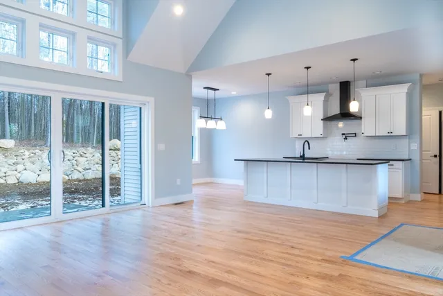 a view of kitchen with wooden floor and window