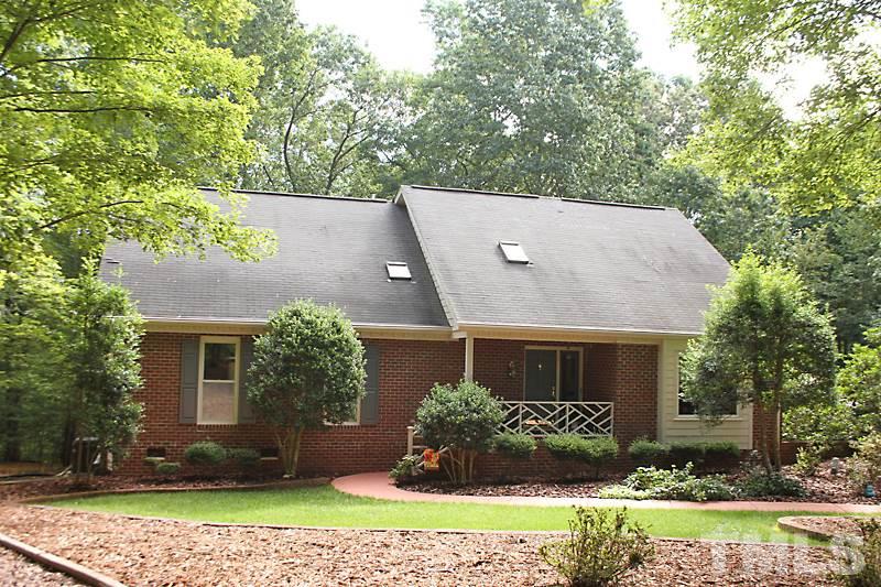 12332 Galway Drive Raleigh, NC 27613 - Photo 1 of 25 Great contemporary feel to this home sitting on .92 acres of private, landscaped earth.
