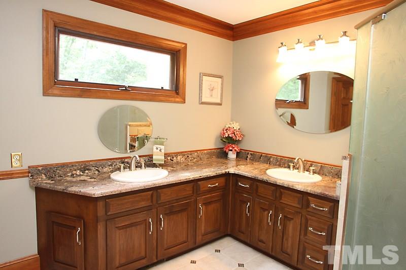 12332 Galway Drive Raleigh, NC 27613 - Photo 14 of 25 Master Bathroom has been updated - new countertops, new free-standing tub, new shower and tile work. Ready to go!