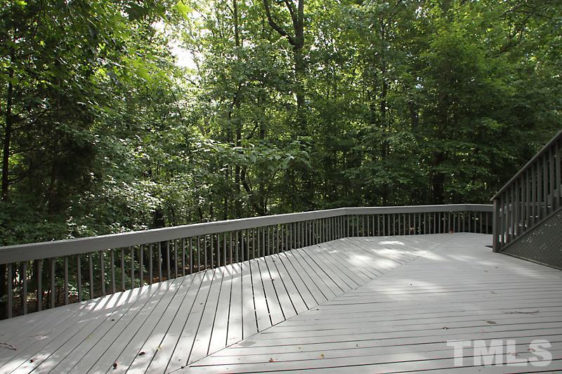 12332 Galway Drive Raleigh, NC 27613 - Photo 23 of 25 Bottom level of the 3 level deck. One of the largest decks on any home I have seen. Great for outdoor living, playing and entertaining.