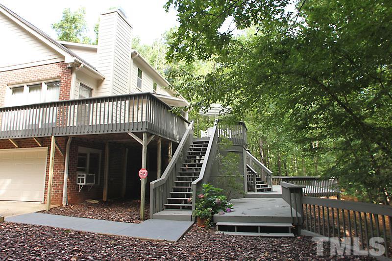 12332 Galway Drive Raleigh, NC 27613 - Photo 25 of 25 Backyard, deck and covered back storage area.