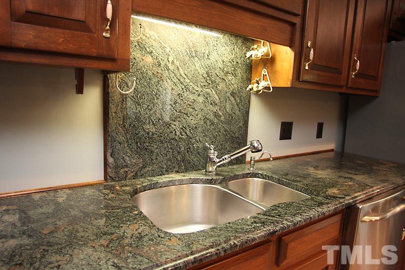 12332 Galway Drive Raleigh, NC 27613 - Photo 10 of 25 Close up view of the double sink area