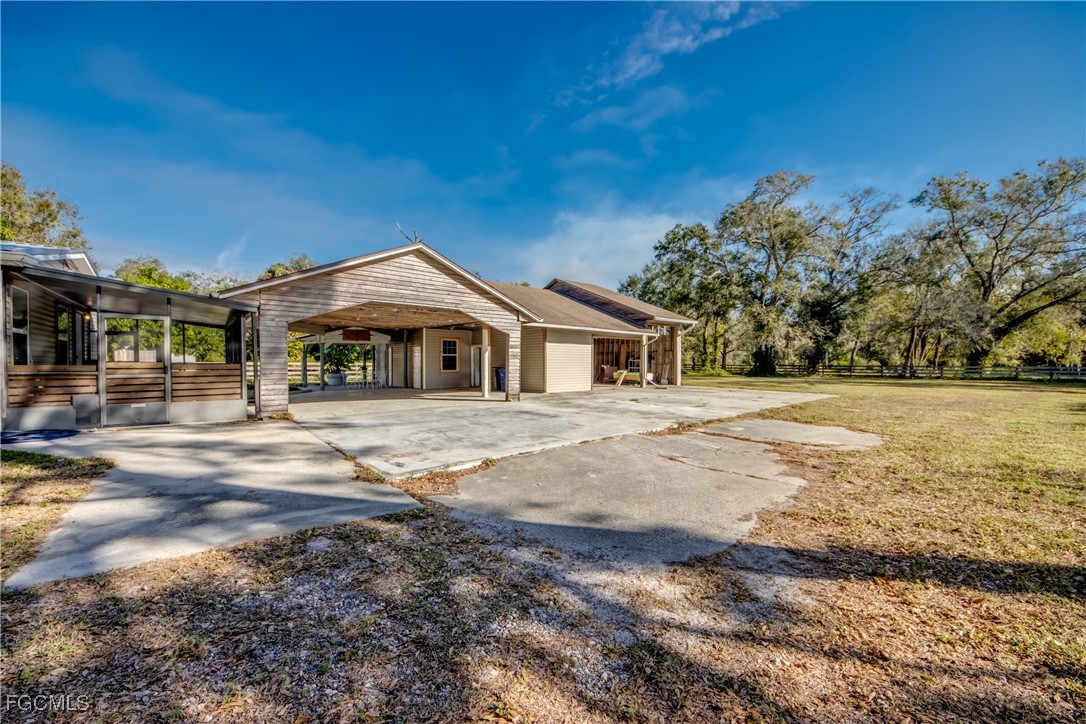 19330 Meredith Road North Fort Myers, FL 33917 - Photo 2 of 50 a front view of a house with a yard