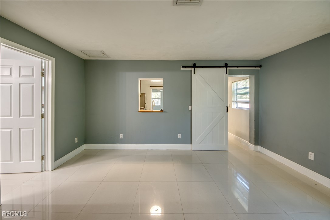 19330 Meredith Road North Fort Myers, FL 33917 - Photo 22 of 50 an empty room with windows and closet