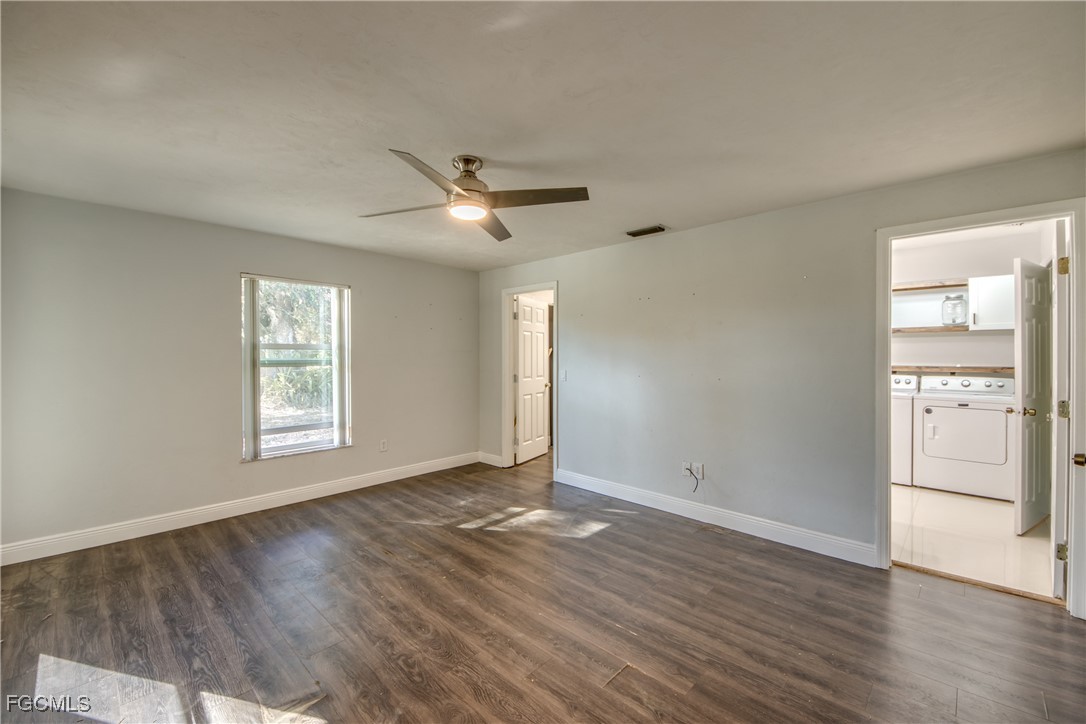 19330 Meredith Road North Fort Myers, FL 33917 - Photo 26 of 50 an empty room with wooden floor and windows