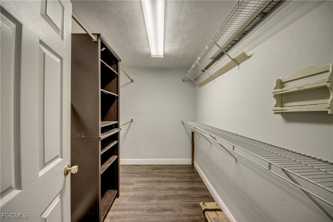 19330 Meredith Road North Fort Myers, FL 33917 - Photo 28 of 50 a view of walk in closet with empty racks
