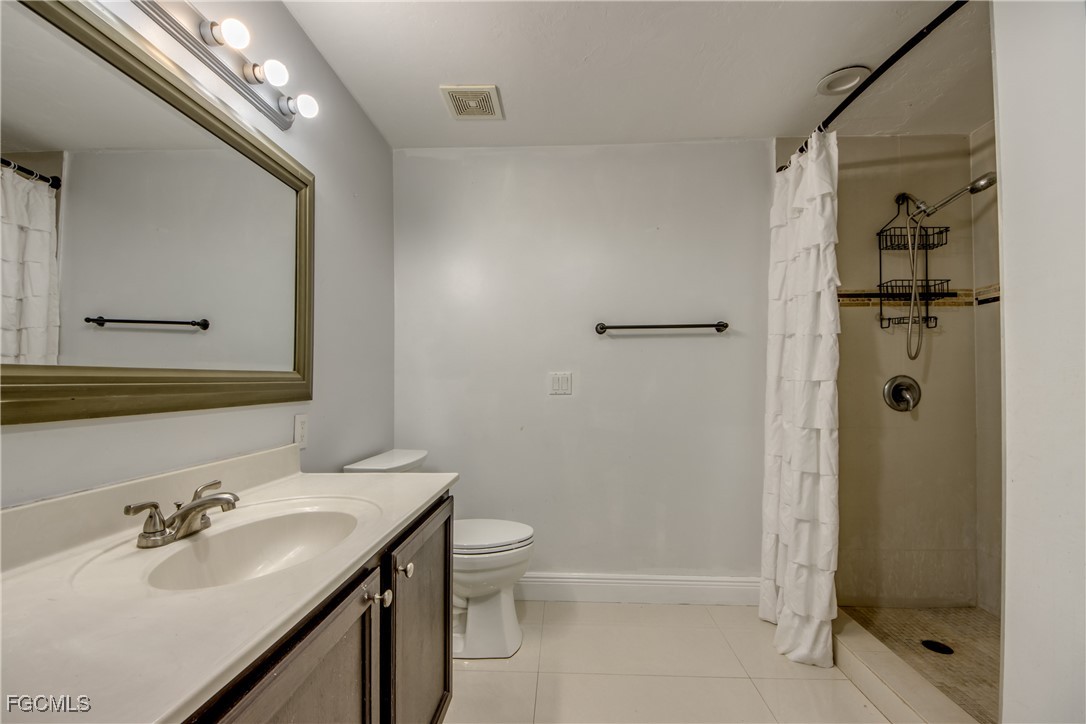 19330 Meredith Road North Fort Myers, FL 33917 - Photo 31 of 50 a bathroom with a sink toilet and shower