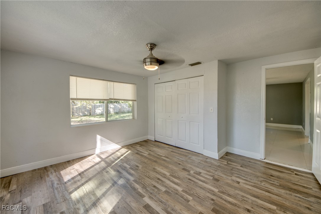 19330 Meredith Road North Fort Myers, FL 33917 - Photo 33 of 50 a view of a big room with wooden floor and windows