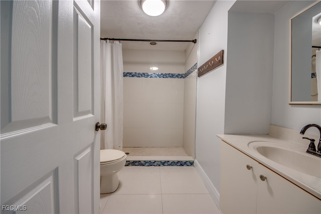 19330 Meredith Road North Fort Myers, FL 33917 - Photo 34 of 50 a bathroom with a sink and a shower