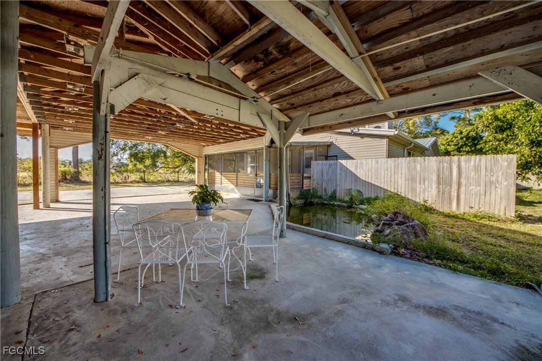 19330 Meredith Road North Fort Myers, FL 33917 - Photo 40 of 50 a view of a porch with furniture and garden