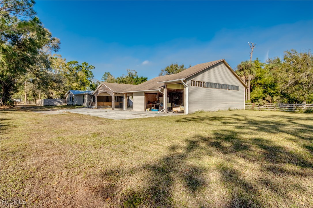 19330 Meredith Road North Fort Myers, FL 33917 - Photo 4 of 50 a front view of a house with a garden