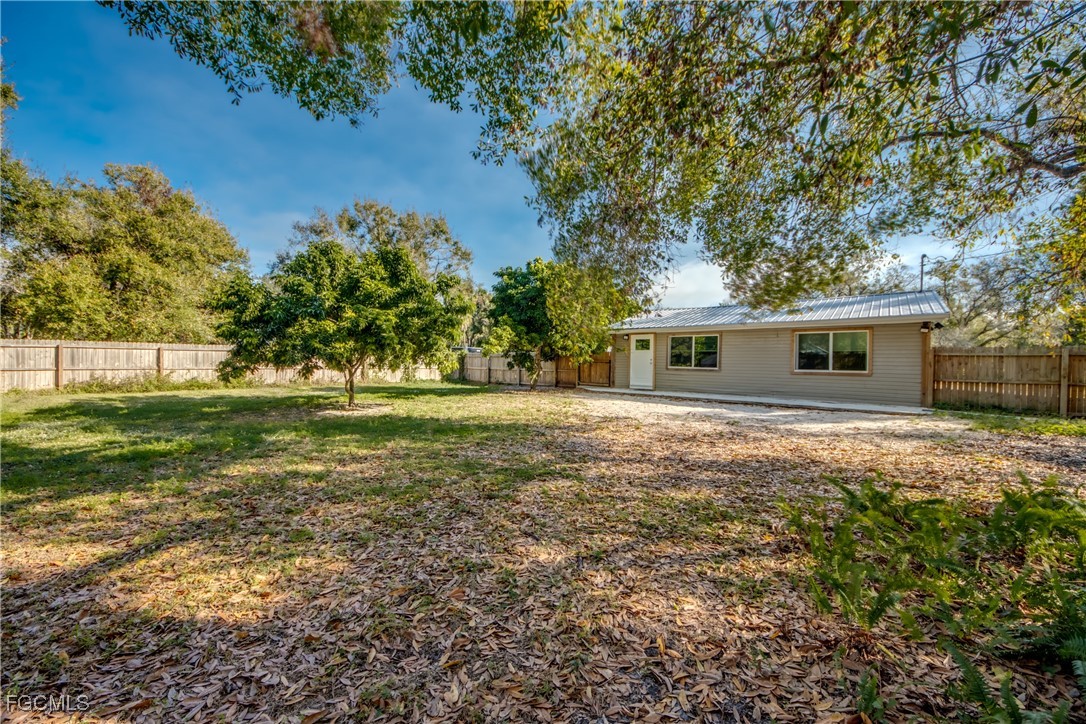 19330 Meredith Road North Fort Myers, FL 33917 - Photo 48 of 50 a backyard of a house with lots of green space
