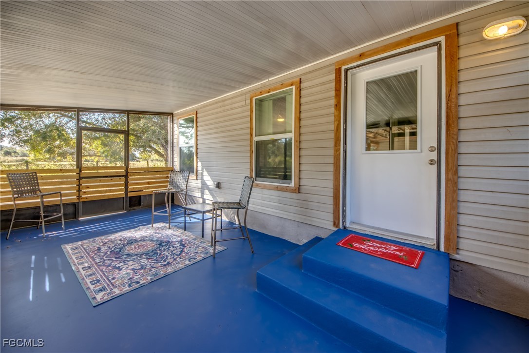 19330 Meredith Road North Fort Myers, FL 33917 - Photo 5 of 50 a living room with furniture and a window