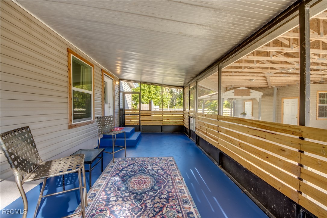 19330 Meredith Road North Fort Myers, FL 33917 - Photo 7 of 50 a view of a large room with wooden floor and furniture