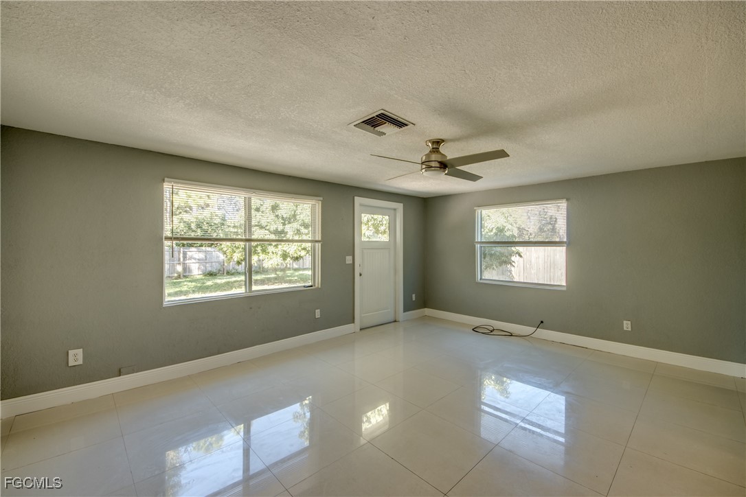 19330 Meredith Road North Fort Myers, FL 33917 - Photo 8 of 50 a view of an empty room with a window
