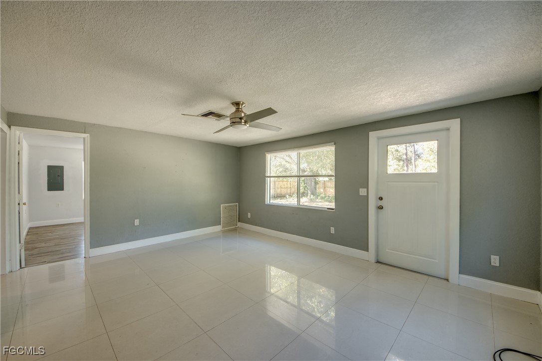19330 Meredith Road North Fort Myers, FL 33917 - Photo 10 of 50 a view of an empty room with a window