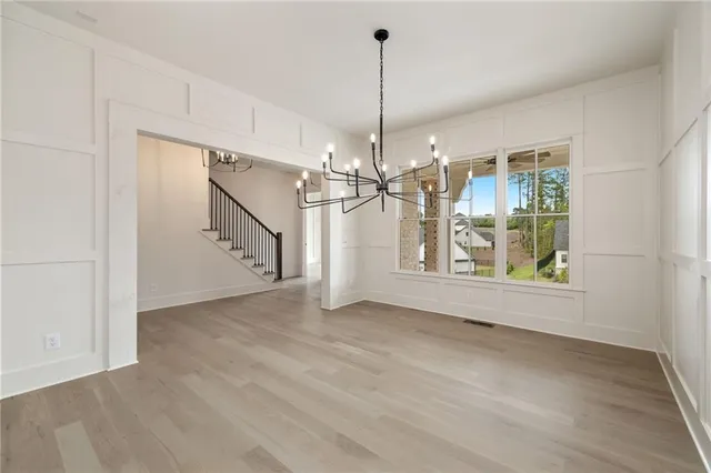 a view of a room with window chandelier